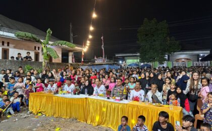 Bhabinkamtibmas Polsek Medansatria Hadiri Pesta Rakyat Kaliabang Pisang Batu dalam Rangka HUT RI ke-81